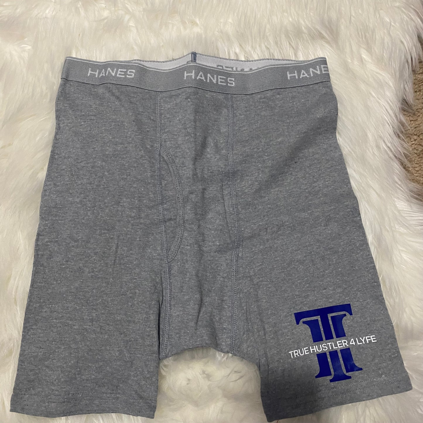 "Upgrade Your Style: Men's Light Grey Boxer Briefs and White T-Shirt Set with Blue Logo"